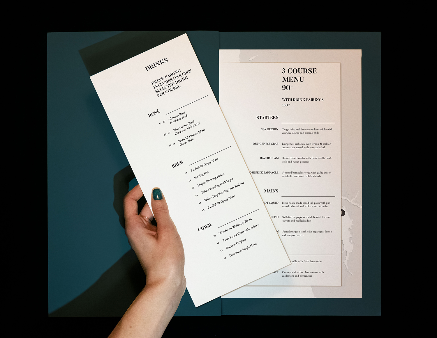 Oystercatcher Restaurant Menu main page with hand holding drink menu.